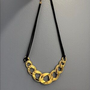 Gold tone metal and black cord Statement Necklace